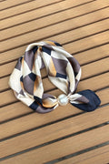 Pearl fasten neck tie cityscape