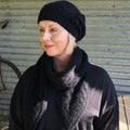 Possum relaxed cable hat pom pom black