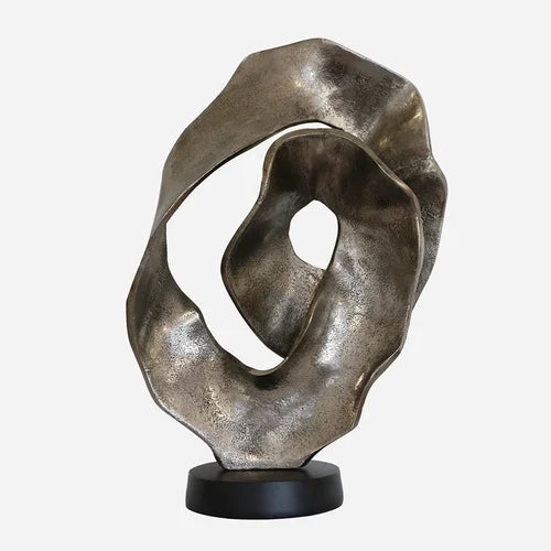 Scalloped sculpture on matt black stand