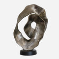 Scalloped sculpture on matt black stand